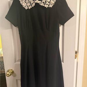 Elegant Black Dress with White Floral Collar